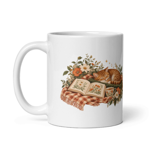 white glossy 11 oz ceramic mug with the A Sunday Well Read sleeping cat and open book illustration, handle on the left