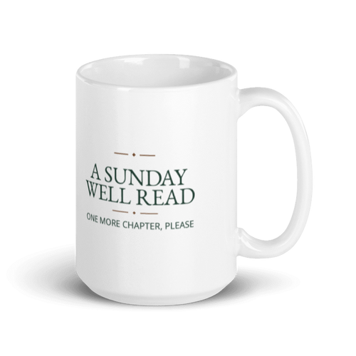 white 11 oz ceramic mug printed with A Sunday Well Read and One More Chapter, Please lettering, handle on the right