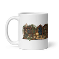 white glossy 11 oz ceramic mug with the Lost in Lovely Chapters moonlit library illustration, handle on the left