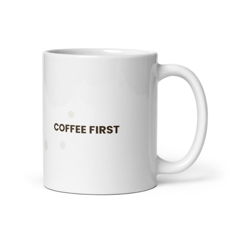 White ceramic mug with the Coffee First design, front view