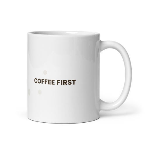 White ceramic mug with the Coffee First design, front view