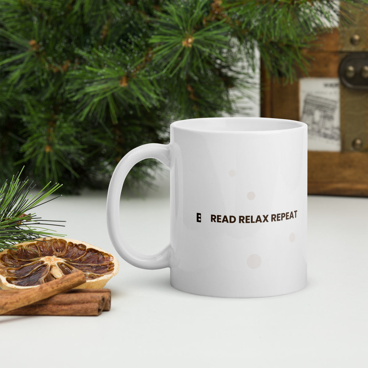 White ceramic mug with the Read Relax Repeat design, 11 oz, with the handle on the left