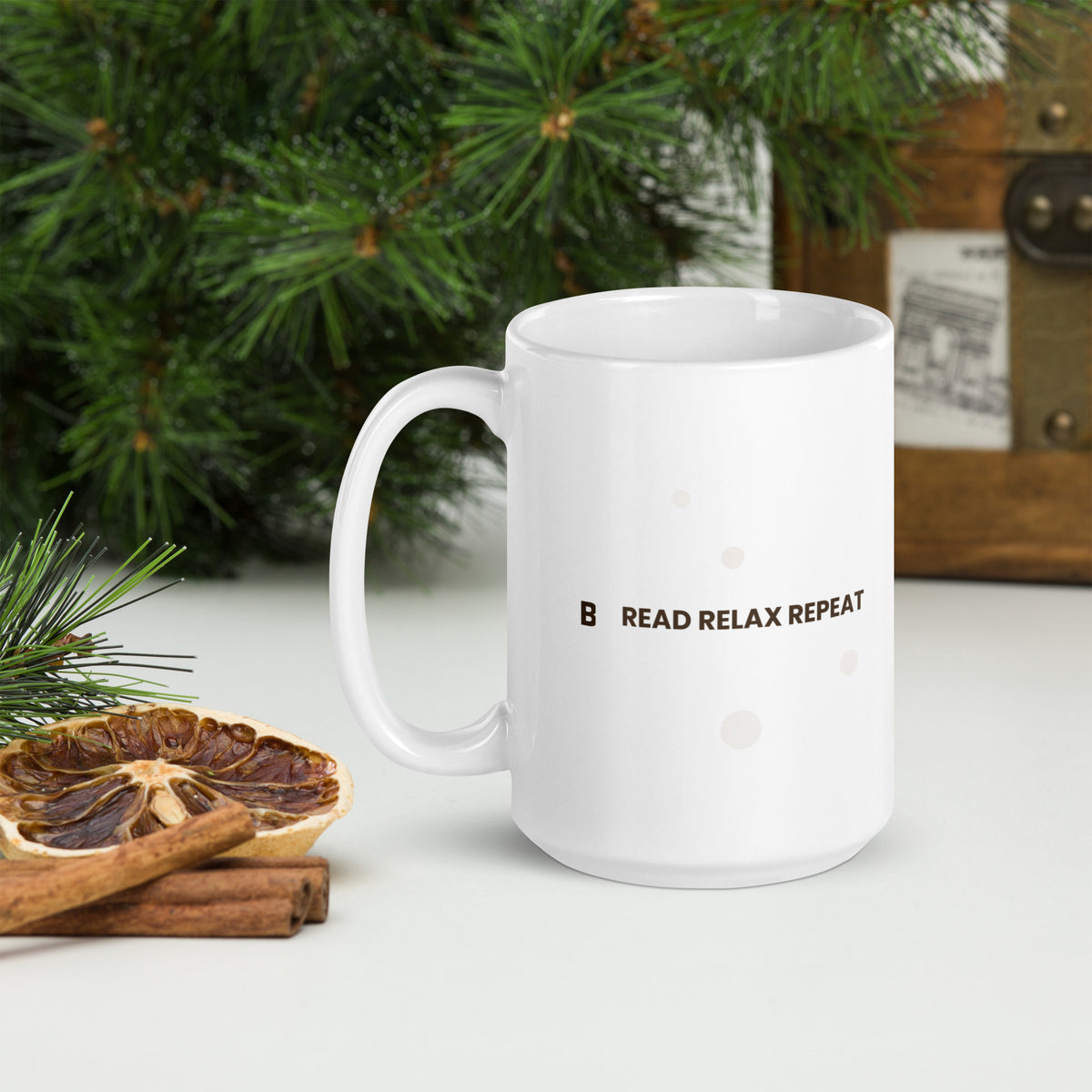 White ceramic mug with the Read Relax Repeat design, 15 oz, with the handle on the left