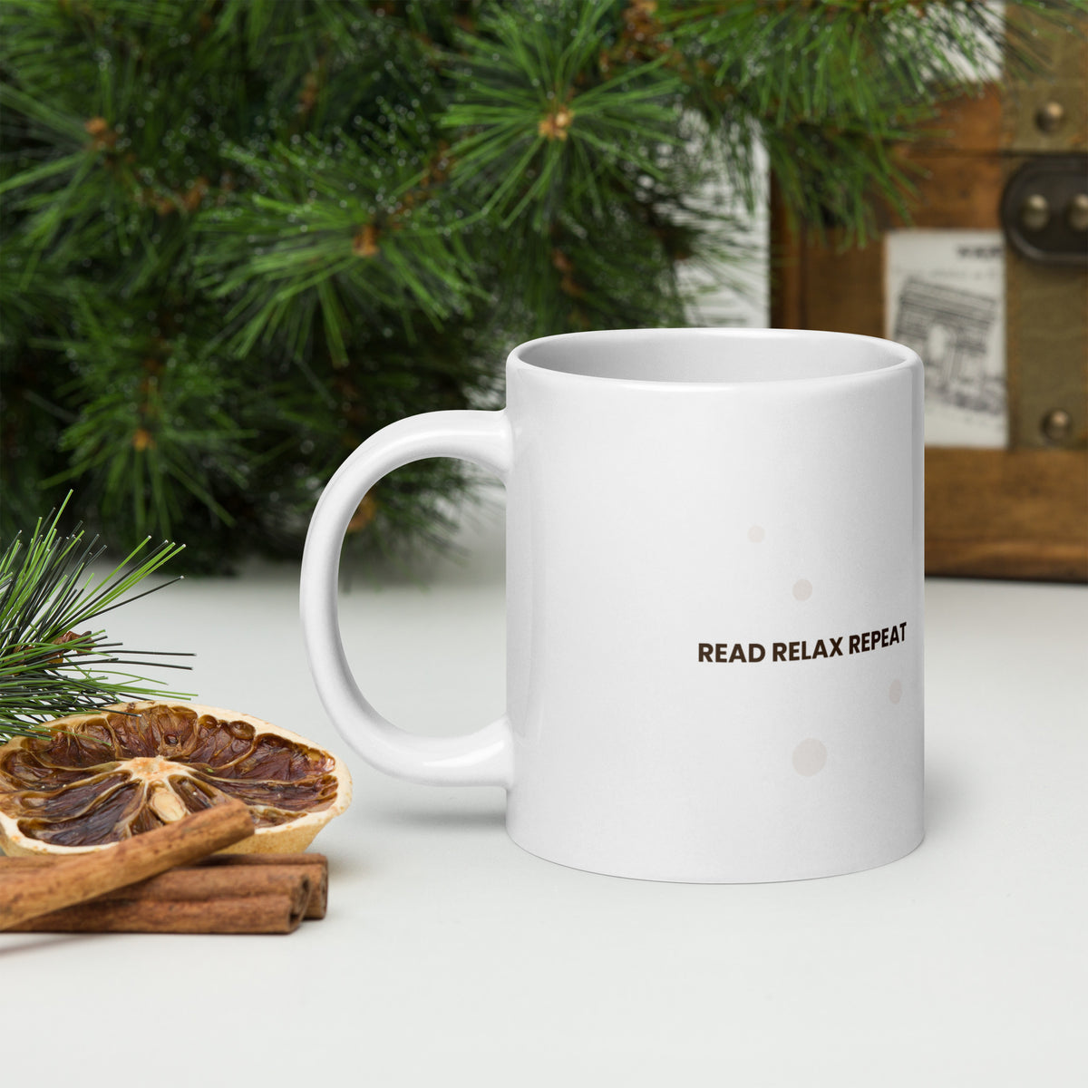 White ceramic mug with the Read Relax Repeat design, 20 oz, with the handle on the left