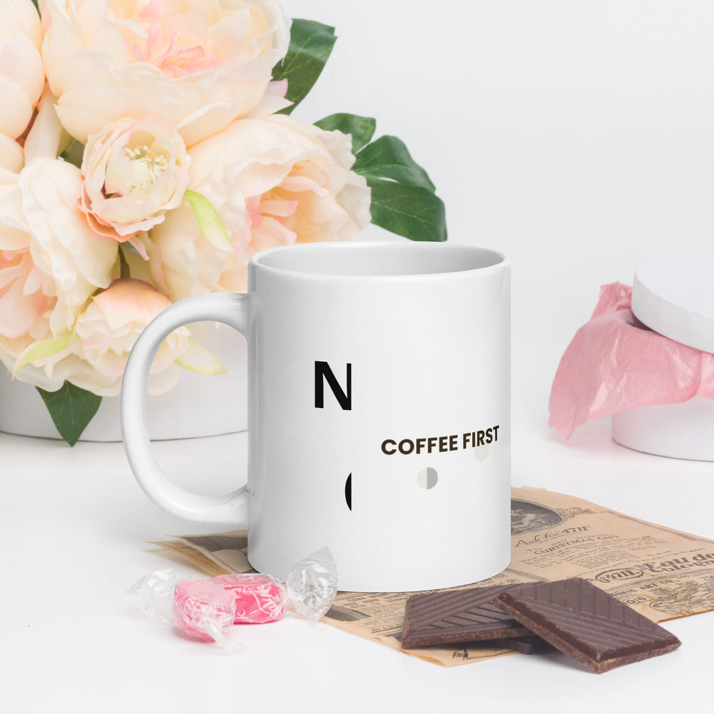 White ceramic mug with the Coffee First design, 20 oz, with the handle on the left