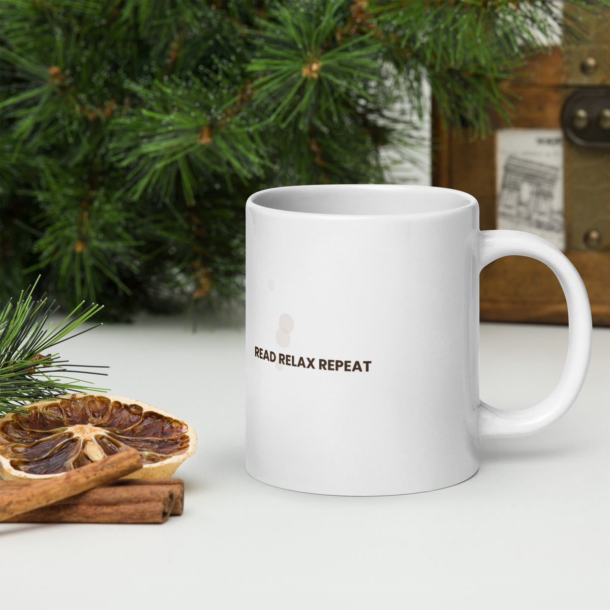 White ceramic mug with the Read Relax Repeat design, 20 oz, with the handle on the right